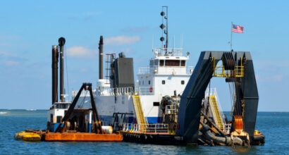 Dredge and Work Barge Lighting - Durable American-made LED solutions including flood lights, waterline perimeter lights, and emergency lighting for safe and efficient dredging operations.